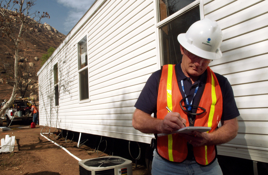 Man inspecting a mobile home